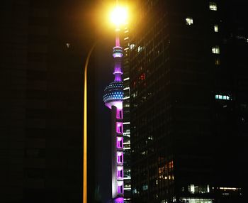 Low angle view of tower at night