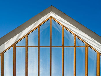 Low angle view of building against clear blue sky