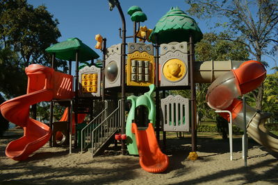 View of playground against trees in park
