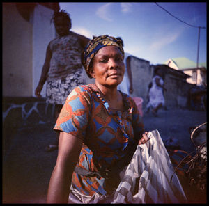 Portrait of woman sitting outdoors