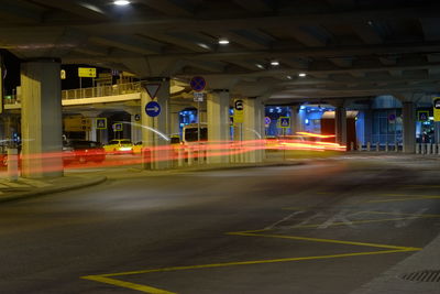 Light trails on road in city at night