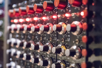 Close-up of wine bottles on rack