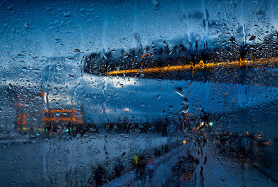 Full frame shot of wet glass window during rainy season