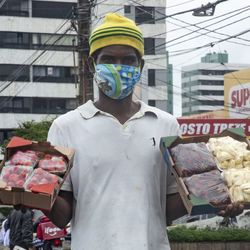 Portrait of man standing against built structure