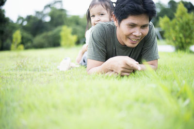 Portrait of cute girl sitting on grass