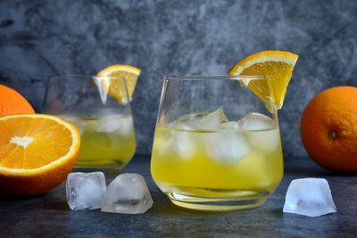 Close-up of orange juice on table