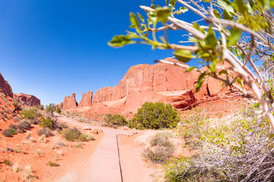 Scenic view of rock formation against clear blue sky