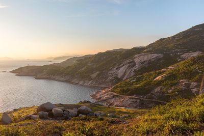 Scenic view of lake against sky during sunset