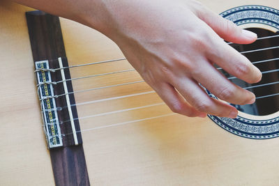 Cropped image of man playing guitar