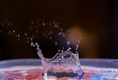 Close-up of water splashing in glass