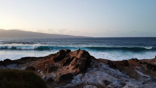 Scenic view of rocks by the sea