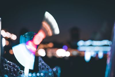 Blurred motion of illuminated multi colored pinwheel toy at night