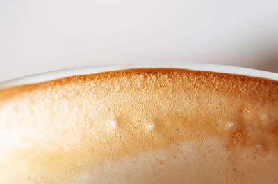 Close-up of coffee cup against white background