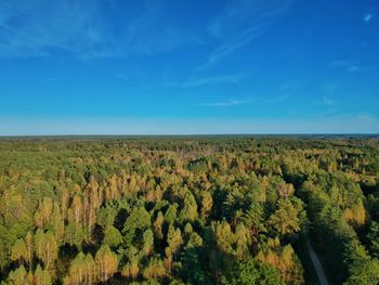 Scenic view of land against blue sky