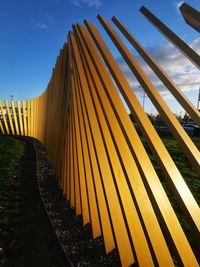 Low angle view of metallic structure against sky