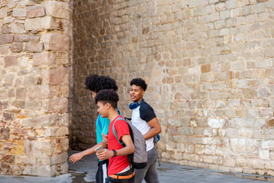 Group of afro latin male friends walking in the street