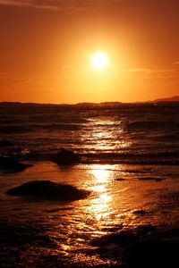 Scenic view of sea at sunset