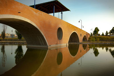 Reflection of bridge against sky