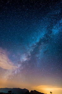 Scenic view of star field against sky at night