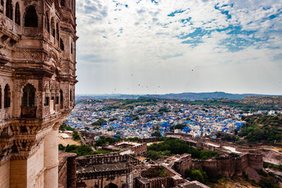 Blue city view from fort with flat bright sky at morning