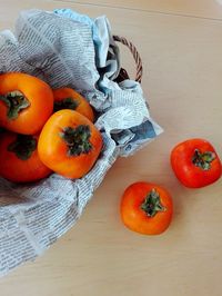 High angle view of orange fruits on table