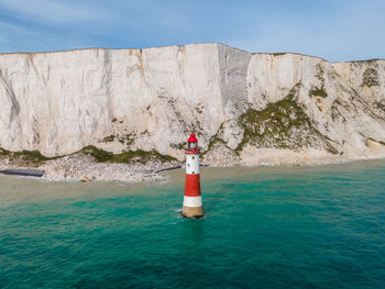 Beachy head lighthouse and the cliffs of the seven sisters in england.