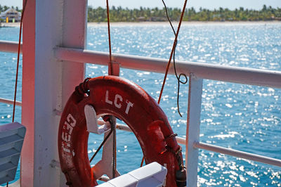 Close-up of life belt hanging on boat