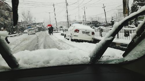 Close-up of cars in snow