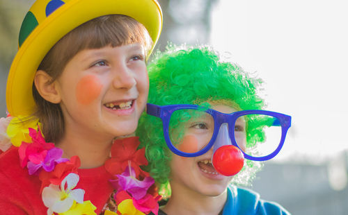 Smiling children wearing costumes during event