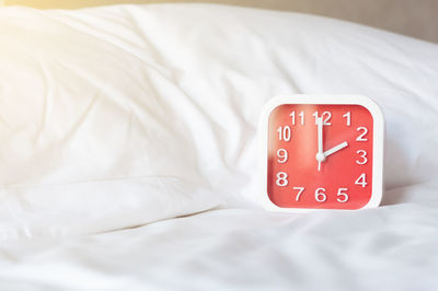 Close-up of arrow sign on bed