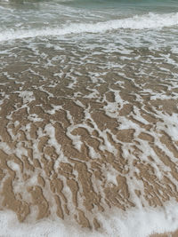 High angle view of sand on beach