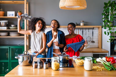 Portrait of smiling friends working at home