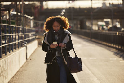 Young woman using cell phone