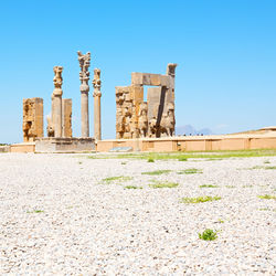 Exterior of temple against clear blue sky