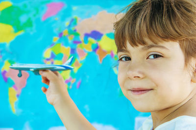 Close-up of girl holding mobile phone