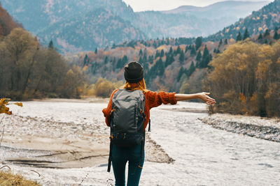 Rear view of man looking at mountains