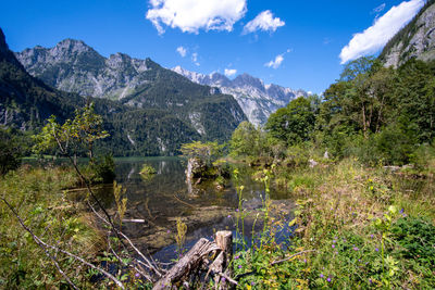 Scenic view of lake and mountains against sky