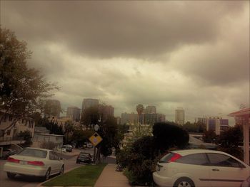 City street and buildings against sky