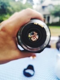 Close-up of hand holding camera