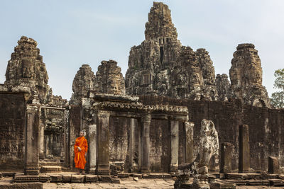 Novice monk in ruined temple