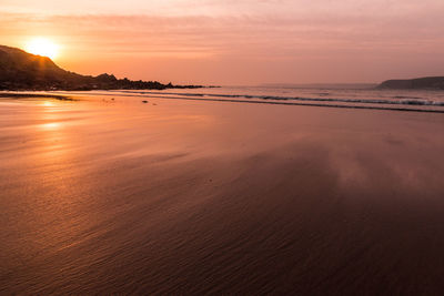 Scenic view of beach during sunset