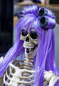 Halloween skeleton with wig and curlers