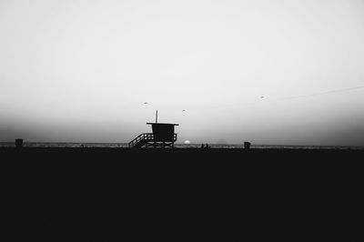 Silhouette of tower against clear sky