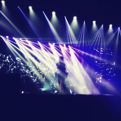 View of illuminated ferris wheel at night