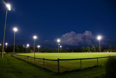 View of illuminated park at night