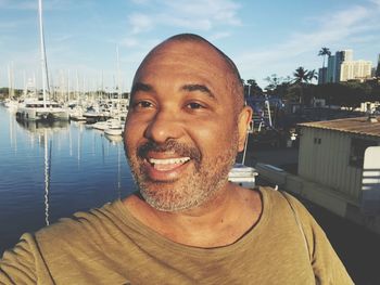 Portrait of cheerful man at harbor