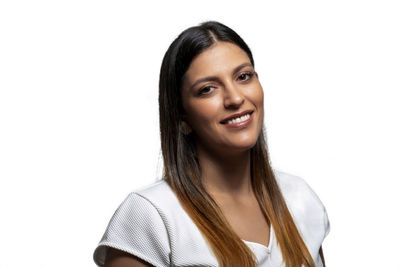 Portrait of a smiling young woman over white background