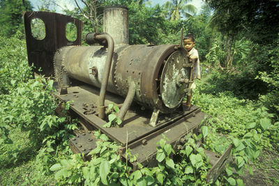 Old rusty wheel on field