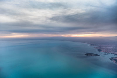 Scenic view of sea against sky at sunset