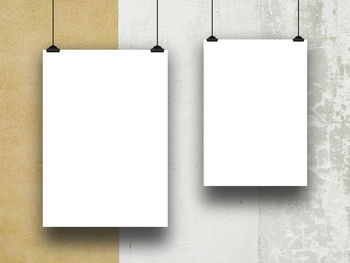 Low angle view of paper hanging on wall